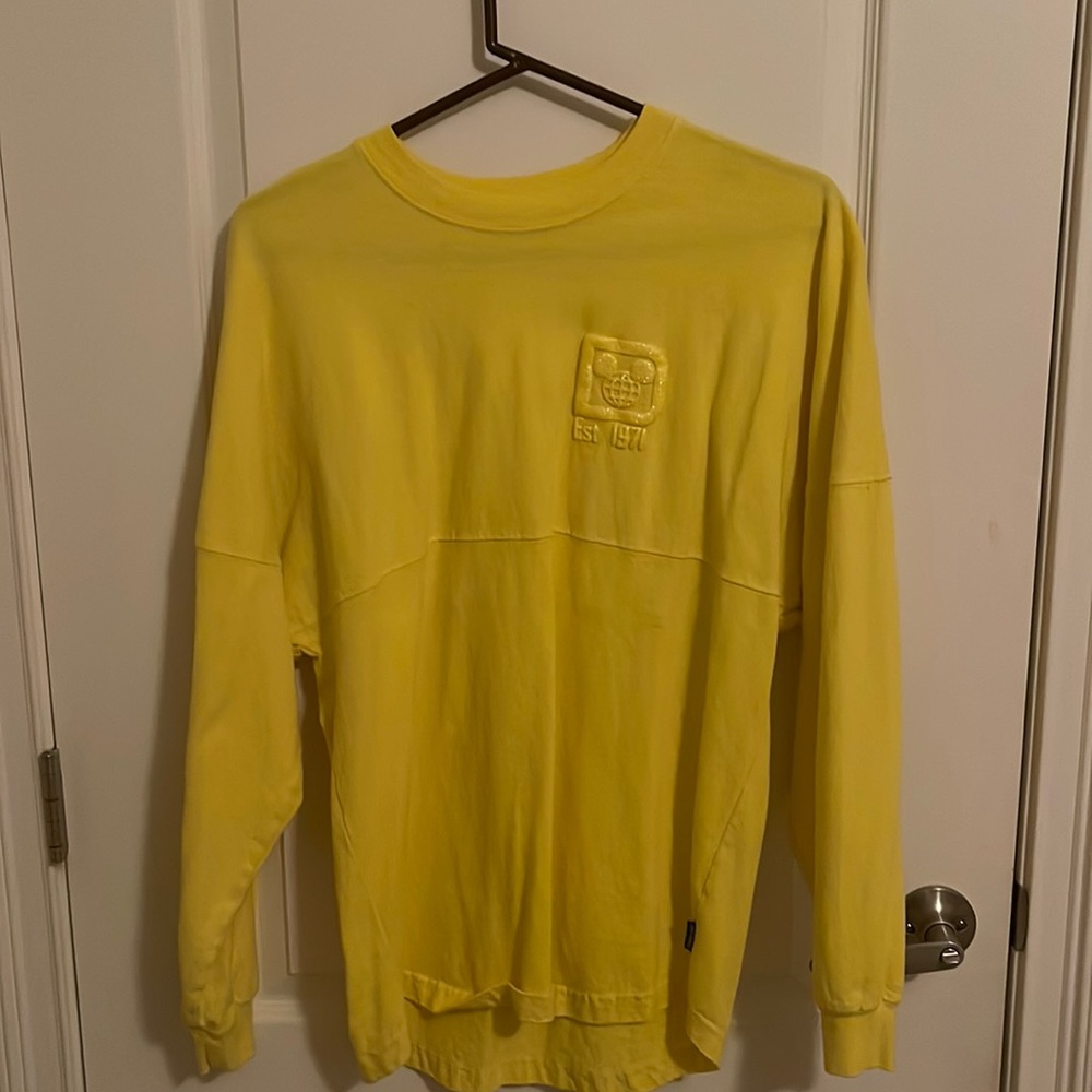 Walt Disney World size small yellow spirit jersey